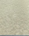 Närbild av en slät, beige spånskiva med subtil textur.
