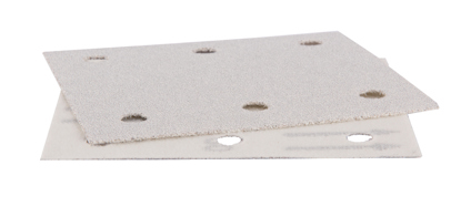 Slipskivor med cirkulära perforeringar, staplade på varandra mot en vit bakgrund.