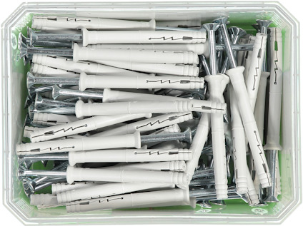 Plastlåda med vita expanderpluggar och skruvar.